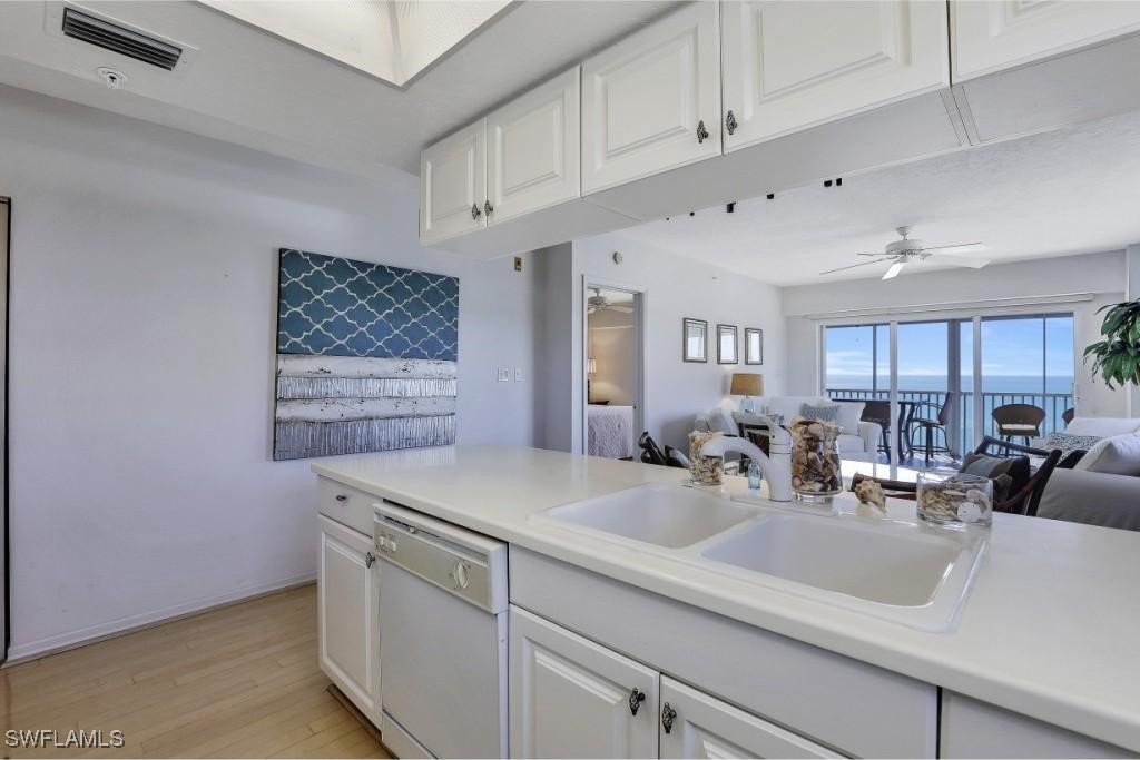 1020 South Collier Boulevard, Unit 507 Marco Island, FL 34145 - Photo 14 of 25 a kitchen with cabinets and window