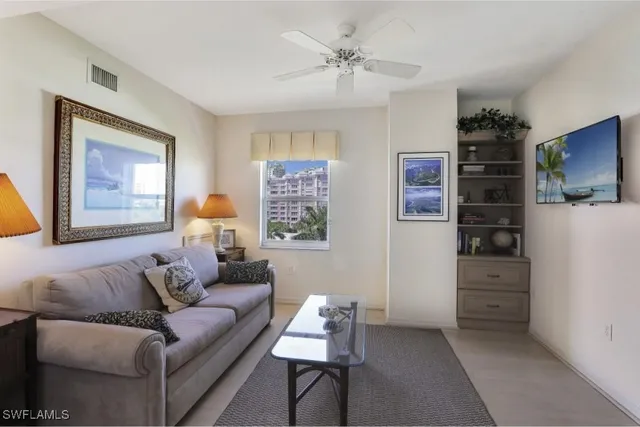 a bedroom with two beds and a window