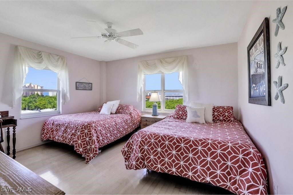 1020 South Collier Boulevard, Unit 507 Marco Island, FL 34145 - Photo 20 of 25 a bedroom with two beds and a window