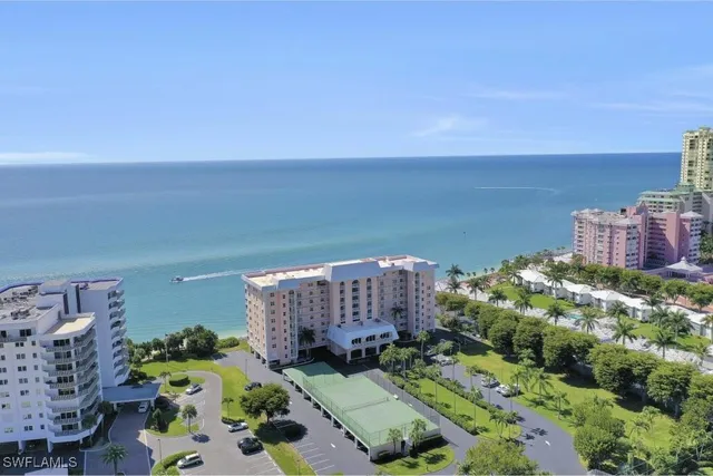 an aerial view of multiple houses with outdoor space