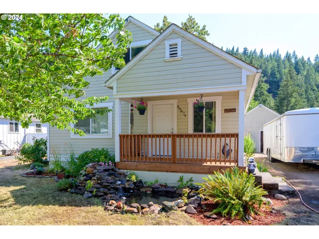 a view of a house with a flower garden