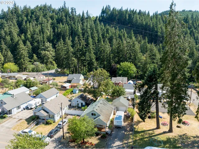 an aerial view of a house with lake view