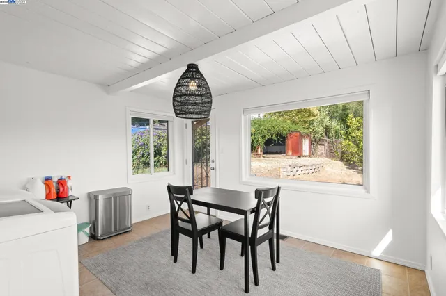 a view of a dining room with furniture window and outside view