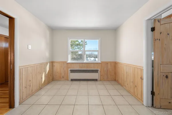 a view of an empty room and window