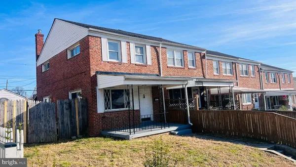 a view of a house with a balcony and door