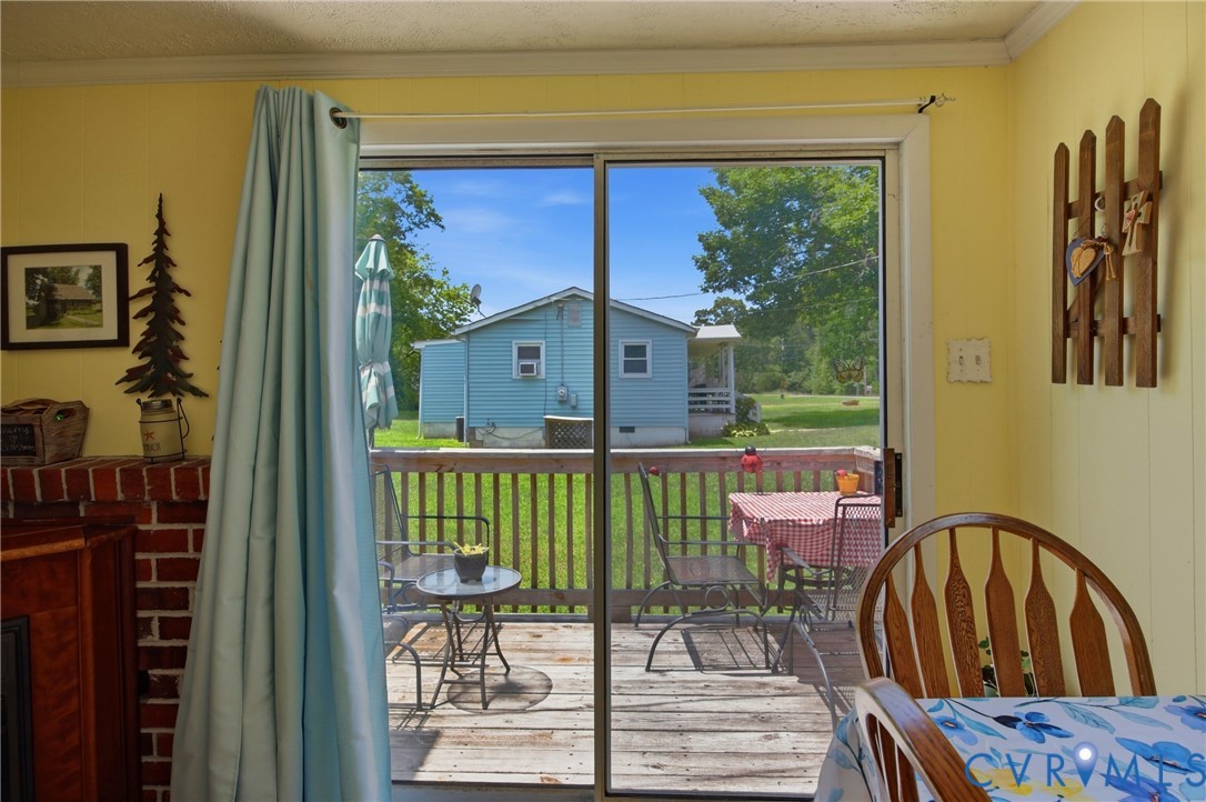 4175 Cedar Plains Road Sandy Hook, VA 23153 - Photo 25 of 31 Sliding glass door opening to an outdoor deck with