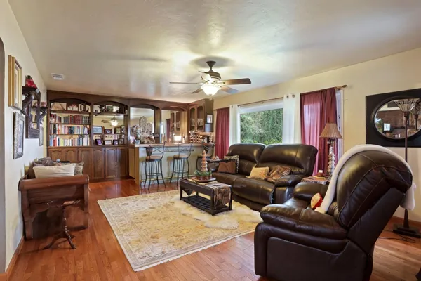 a kitchen with stainless steel appliances granite countertop a stove top oven a sink a counter space and cabinets