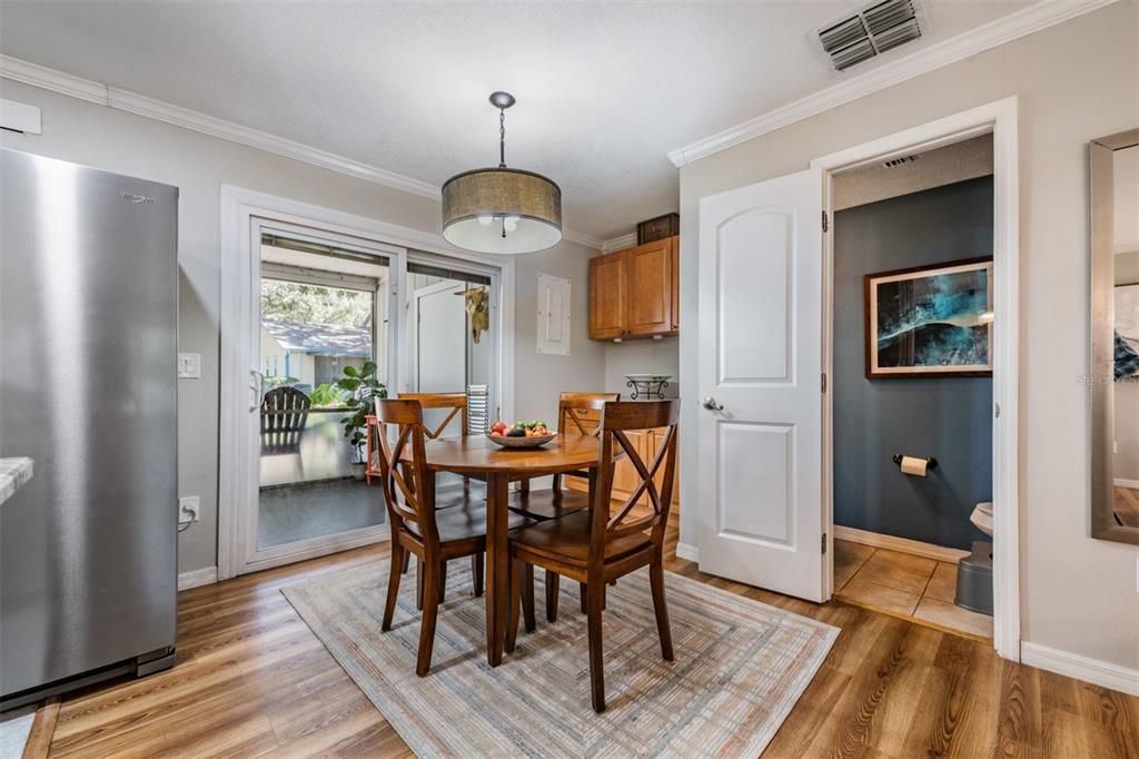 611 St Henry Drive Brandon, FL 33511 - Photo 12 of 34 a view of a dining room with furniture window and wooden floor