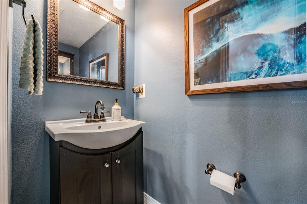611 St Henry Drive Brandon, FL 33511 - Photo 13 of 34 a bathroom with a sink and a mirror