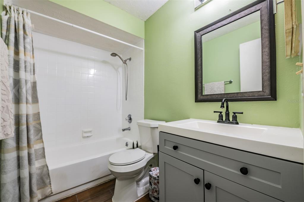 611 St Henry Drive Brandon, FL 33511 - Photo 20 of 34 a bathroom with a sink a toilet and shower