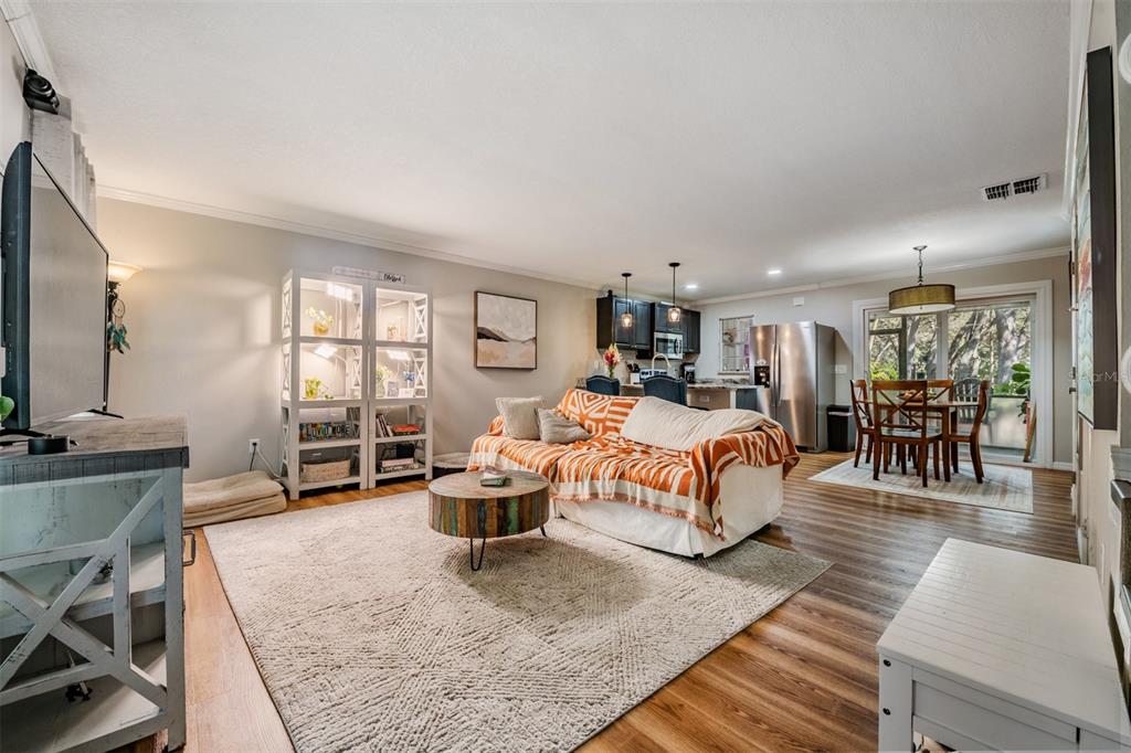 611 St Henry Drive Brandon, FL 33511 - Photo 3 of 34 a bed room with a bed and a chair