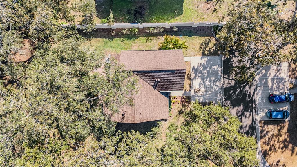 611 St Henry Drive Brandon, FL 33511 - Photo 32 of 34 an aerial view of a house with a yard swimming pool and outdoor seating