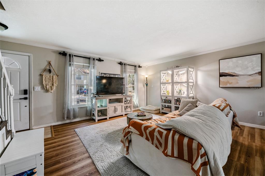 611 St Henry Drive Brandon, FL 33511 - Photo 4 of 34 a bedroom with a bed and a flat screen tv