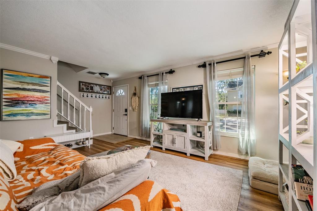 611 St Henry Drive Brandon, FL 33511 - Photo 5 of 34 a living room with furniture and a flat screen tv