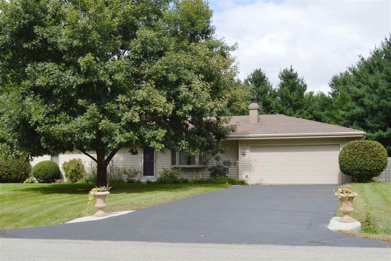 5642 Gray Eagle Road Roscoe, IL 61073 - Photo 1 of 15 a front view of a house with a yard
