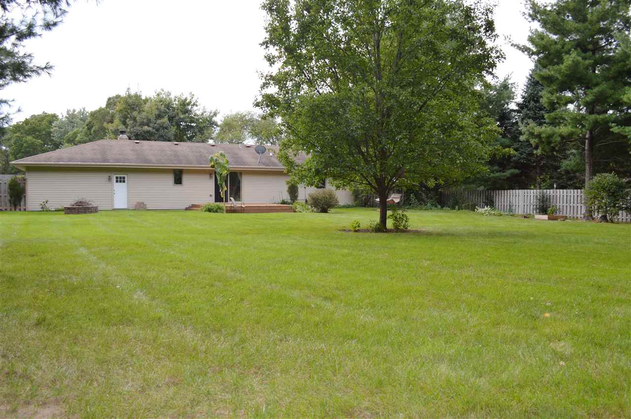 5642 Gray Eagle Road Roscoe, IL 61073 - Photo 13 of 15 a view of a house with a yard and a tree