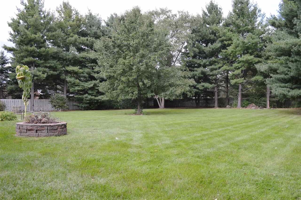 5642 Gray Eagle Road Roscoe, IL 61073 - Photo 14 of 15 a view of a garden with trees