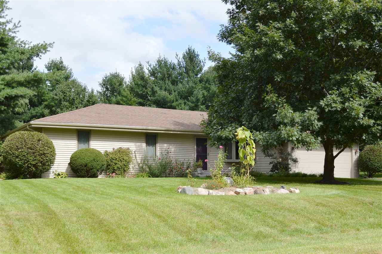 5642 Gray Eagle Road Roscoe, IL 61073 - Photo 2 of 15 a front view of a house with garden