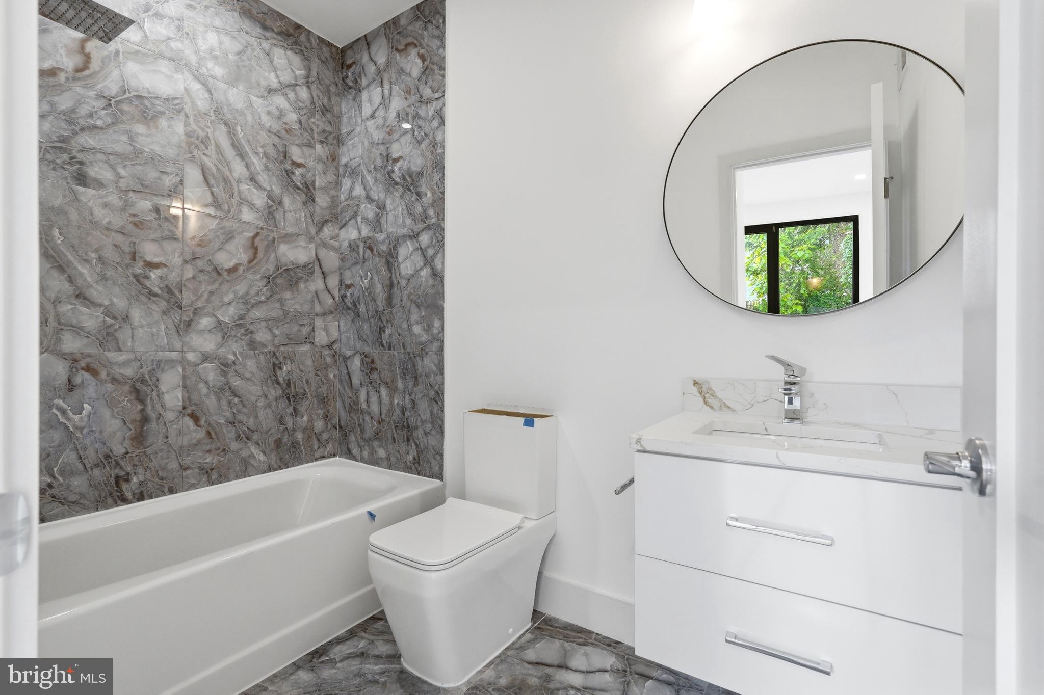 1810 Central Place Northeast, Unit 1 Washington, DC 20002 - Photo 18 of 36 a bathroom with a sink and a mirror