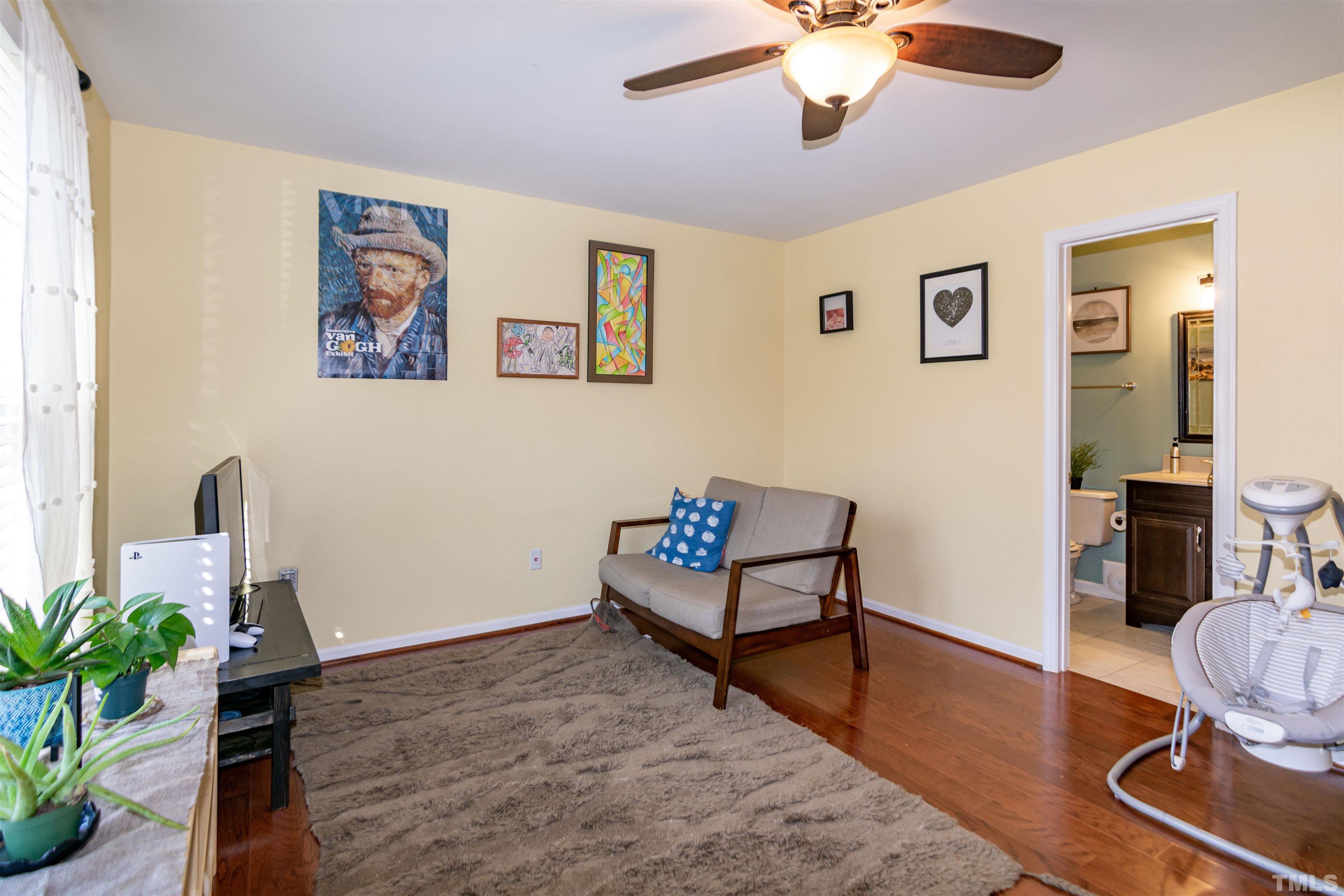 6722 Twin Tree Court Raleigh, NC 27613 - Photo 17 of 33 a living room with furniture and a potted plant