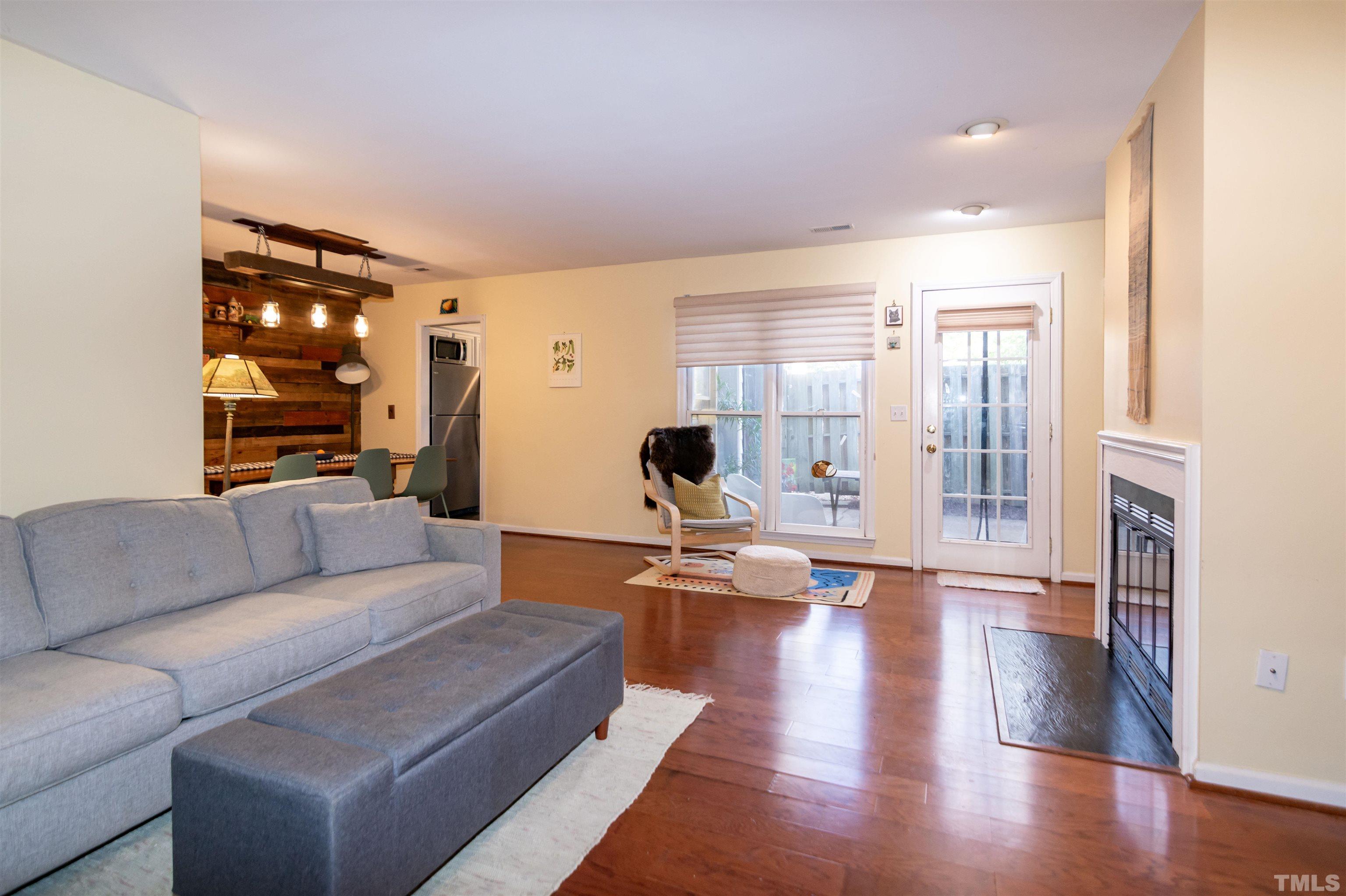 6722 Twin Tree Court Raleigh, NC 27613 - Photo 5 of 33 a living room with furniture and wooden floor