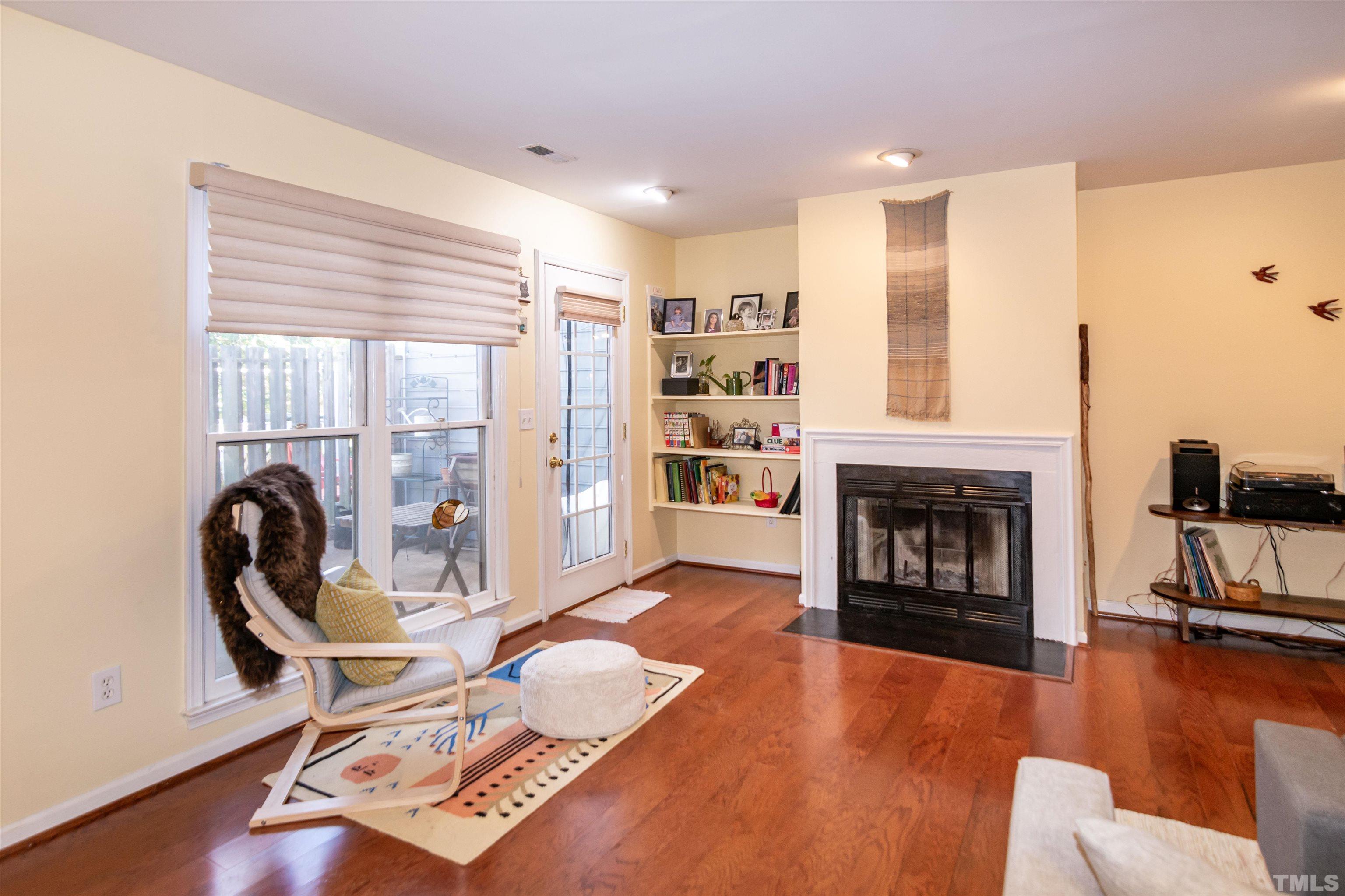 6722 Twin Tree Court Raleigh, NC 27613 - Photo 6 of 33 a living room with furniture and a fireplace