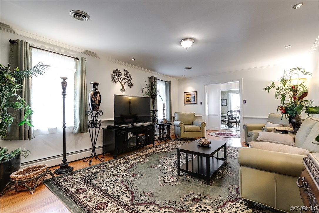 1430 Bloomfield Road Richmond, VA 23225 - Photo 11 of 47 a living room with furniture and a flat screen tv