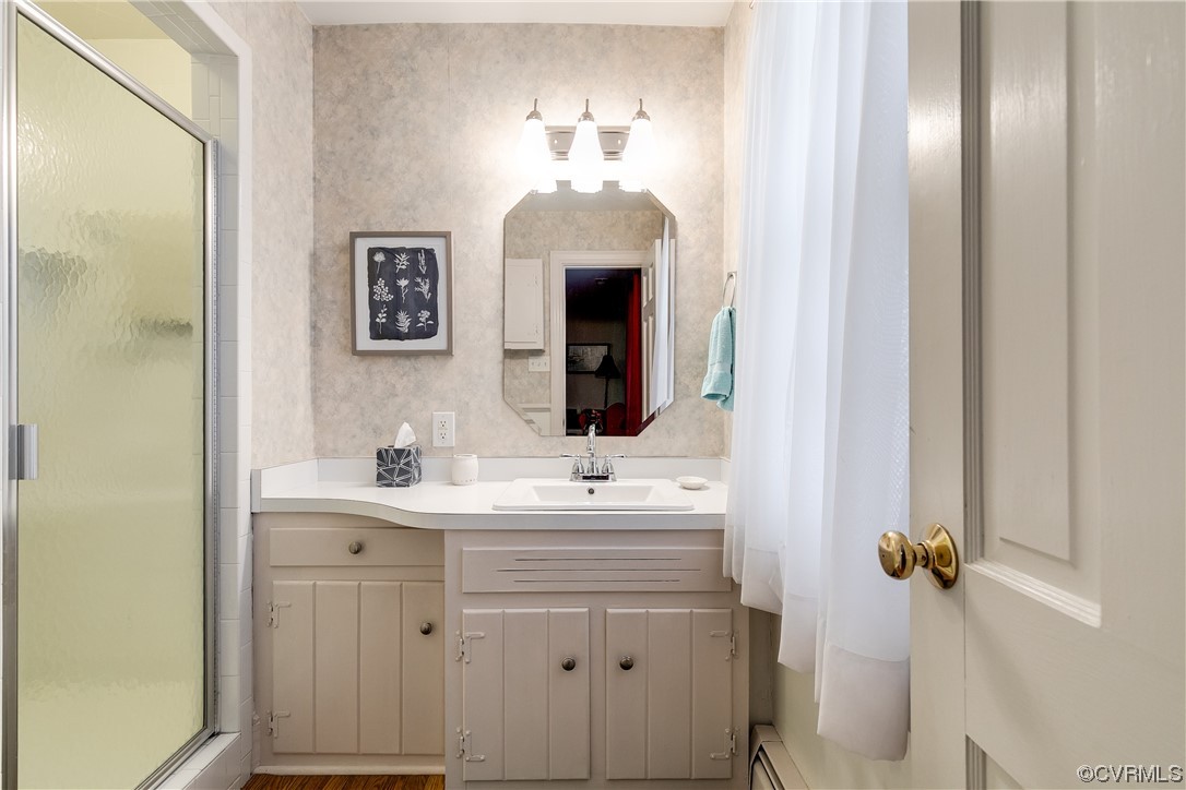 1430 Bloomfield Road Richmond, VA 23225 - Photo 14 of 47 a bathroom with a sink vanity and a mirror