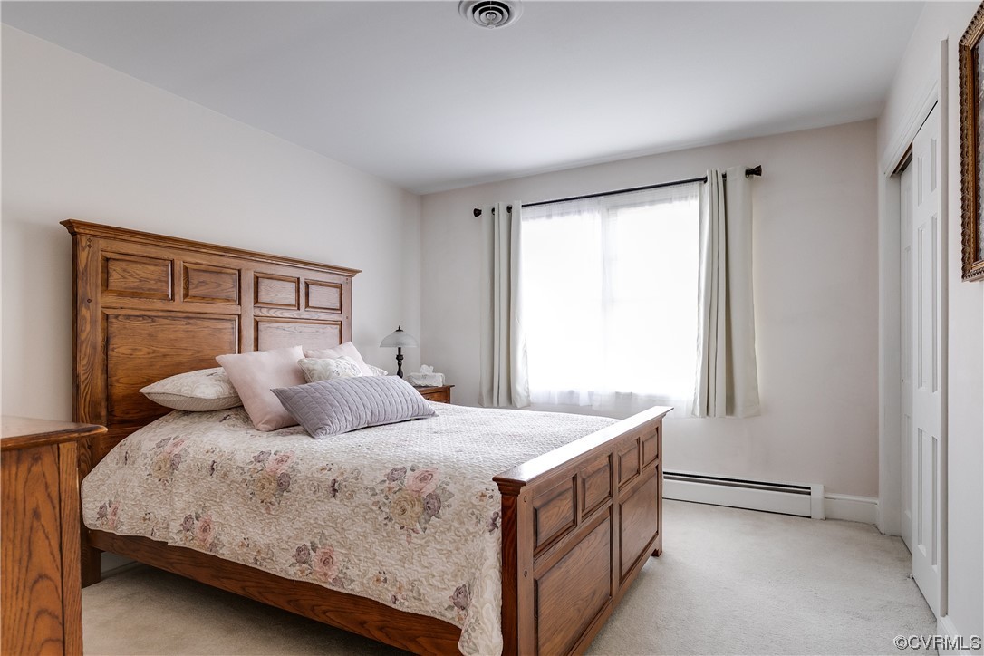 1430 Bloomfield Road Richmond, VA 23225 - Photo 15 of 47 a bedroom with a bed and a window