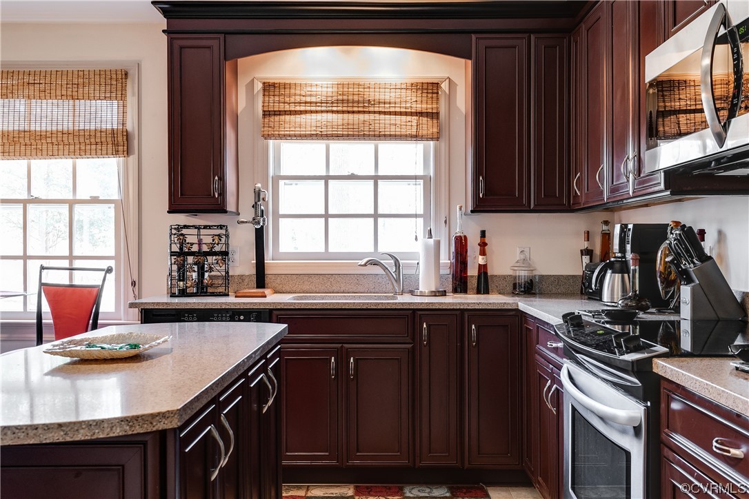 1430 Bloomfield Road Richmond, VA 23225 - Photo 23 of 47 a kitchen with stainless steel appliances granite countertop a sink stove and cabinets