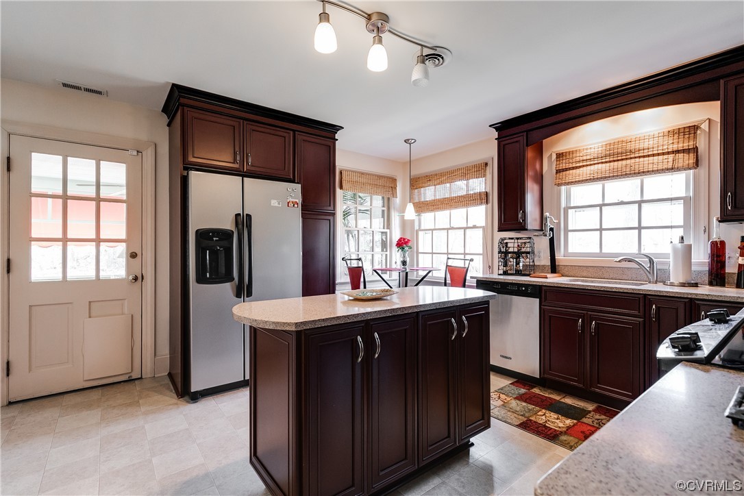 1430 Bloomfield Road Richmond, VA 23225 - Photo 24 of 47 a kitchen with stainless steel appliances granite countertop a sink stove and refrigerator