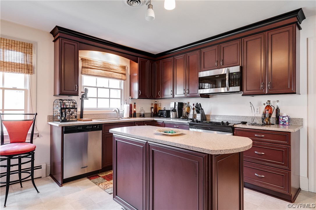 1430 Bloomfield Road Richmond, VA 23225 - Photo 26 of 47 a kitchen with stainless steel appliances granite countertop a sink a stove a microwave cabinets and a window