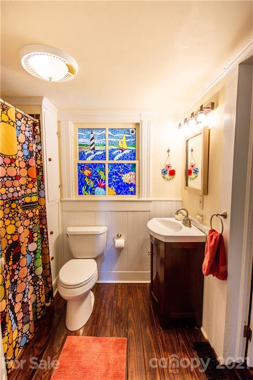 1870 Centenary Church Road Mount Ulla, NC 28125 - Photo 11 of 48 a living room with a couch and paintings on the wall