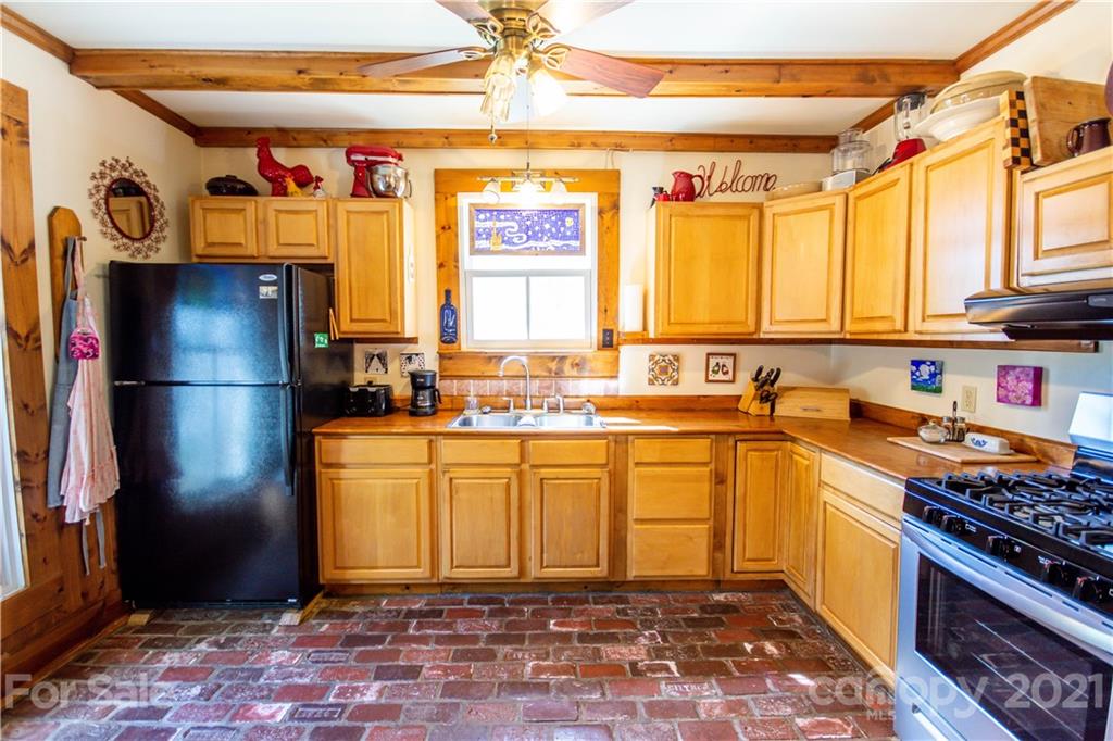 1870 Centenary Church Road Mount Ulla, NC 28125 - Photo 15 of 48 a kitchen with stainless steel appliances granite countertop a refrigerator and a sink
