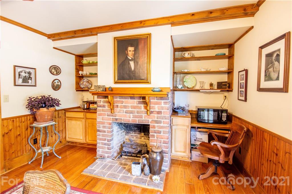 1870 Centenary Church Road Mount Ulla, NC 28125 - Photo 18 of 48 a living room with fireplace furniture and a wooden floor