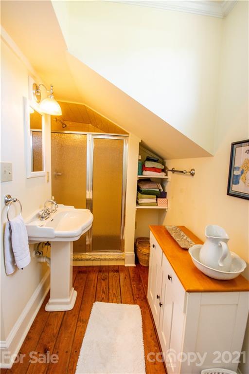 1870 Centenary Church Road Mount Ulla, NC 28125 - Photo 26 of 48 a bathroom with a sink and mirror with bathtub