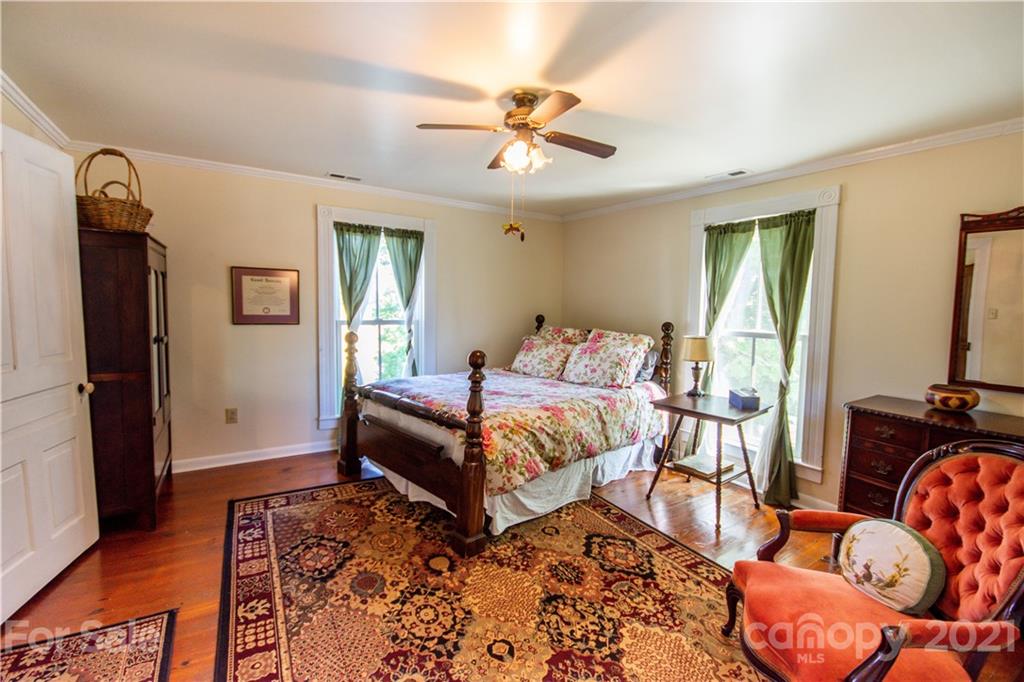 1870 Centenary Church Road Mount Ulla, NC 28125 - Photo 29 of 48 a bedroom with a bed and wooden floor