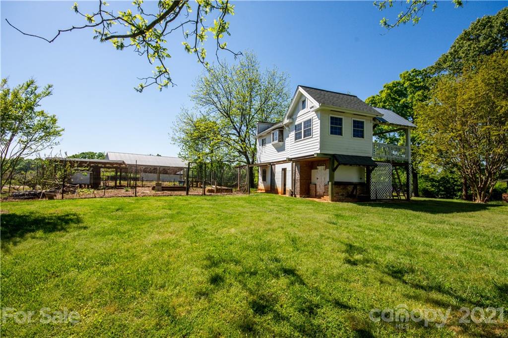 1870 Centenary Church Road Mount Ulla, NC 28125 - Photo 36 of 48 a front view of a house with a garden and trees