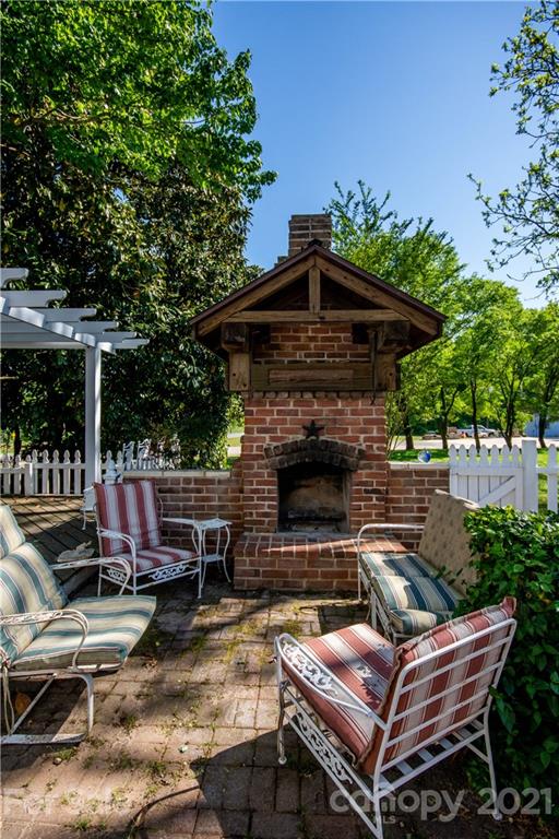 1870 Centenary Church Road Mount Ulla, NC 28125 - Photo 41 of 48 a backyard of a house with yard barbeque oven and outdoor seating
