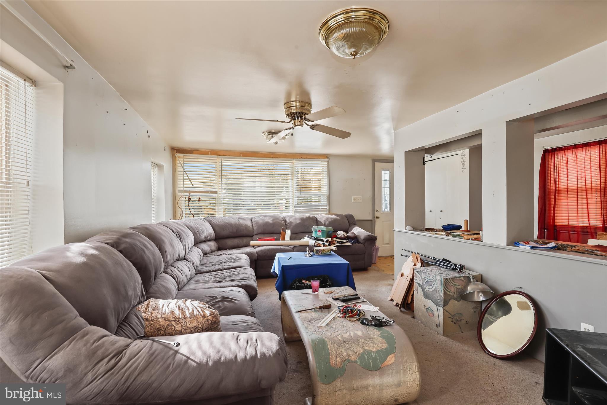 8215 Bon Air Road Baltimore, MD 21234 - Photo 5 of 19 a living room with furniture gym equipment and a large window