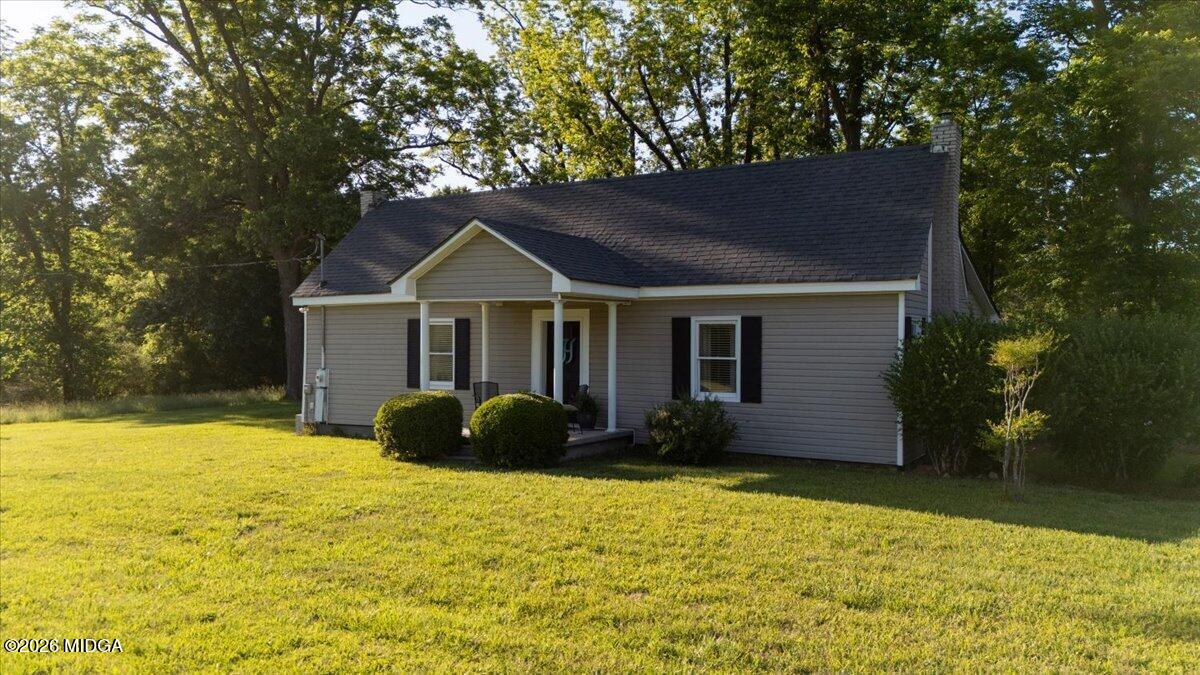 214 Howard Roberts Road Gray, GA 31032 - Photo 2 of 36 a front view of a house with a yard