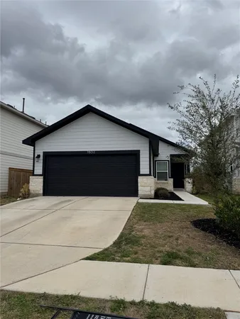 a front view of a house with yard