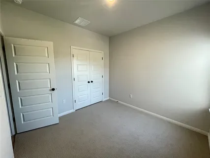 an empty room with closet