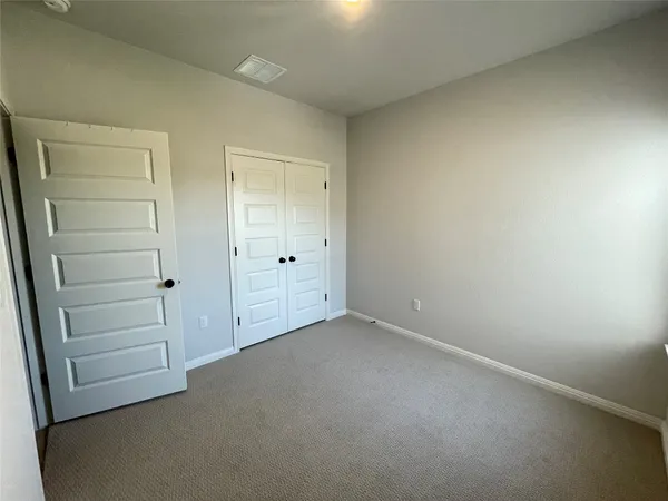 an empty room with closet