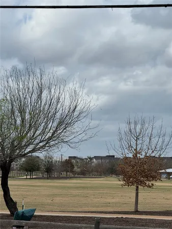 a view of a yard in front of a house