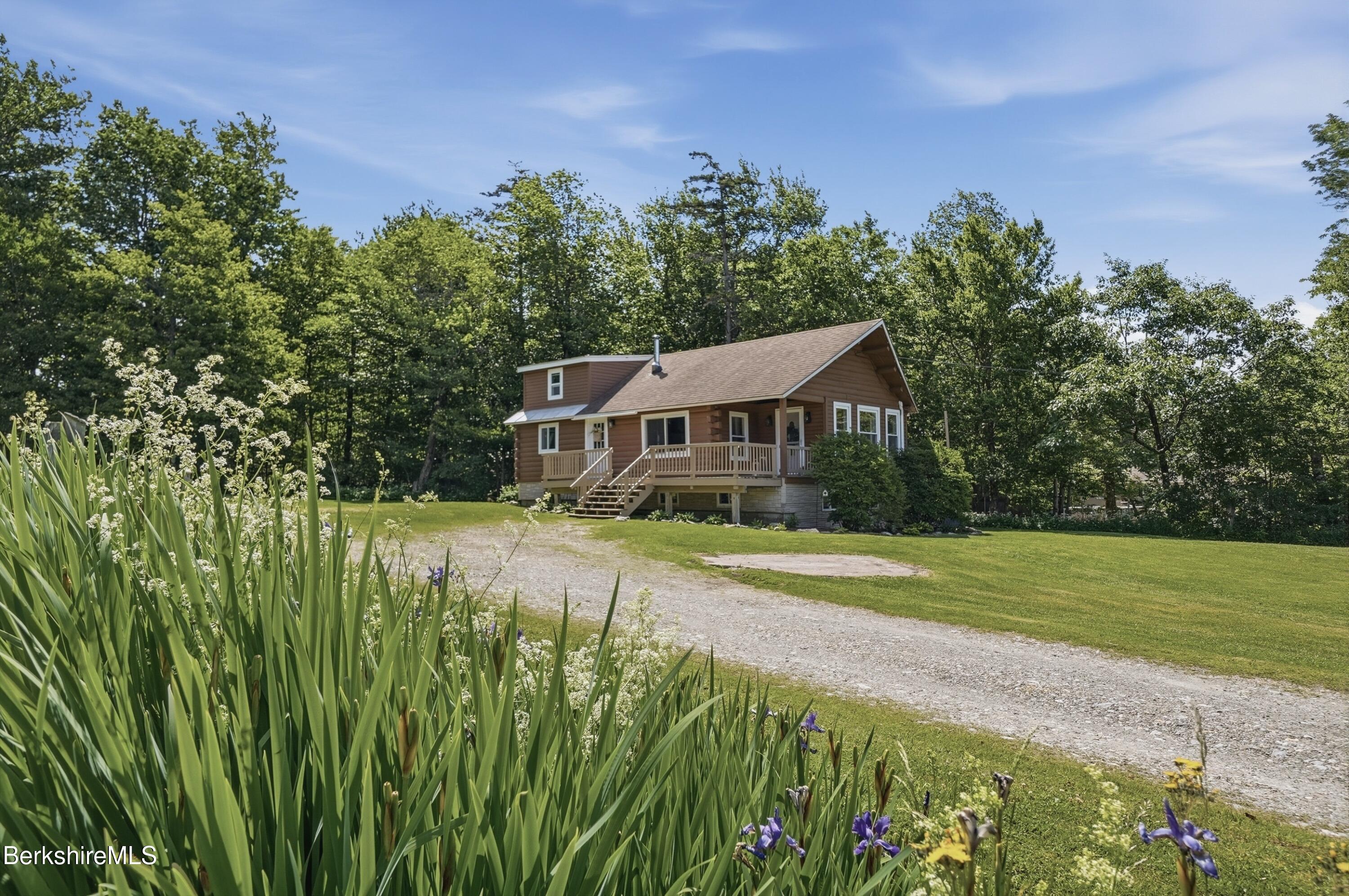 4 David Drive Peru, MA 01235 - Photo 40 of 44 a front view of a house with a yard