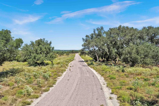 a view of a pathway with a yard