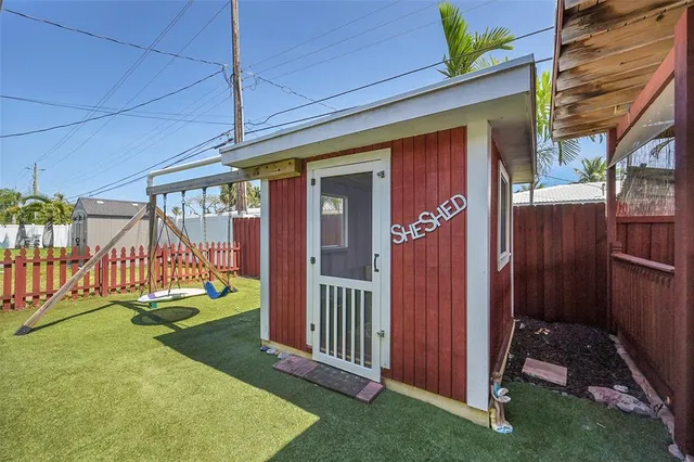 a view of a house with a yard and deck
