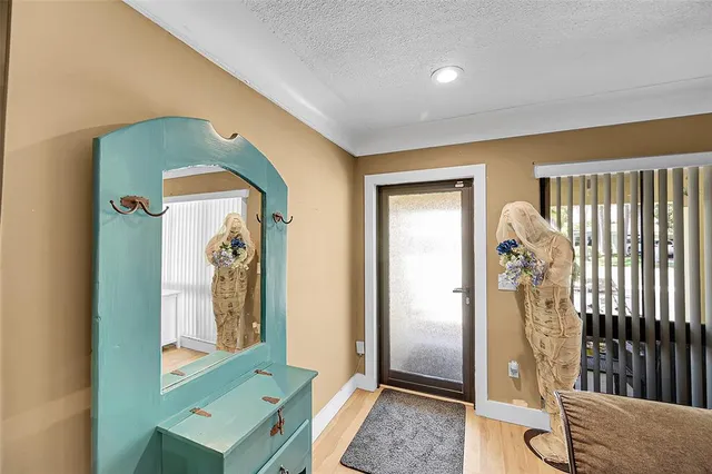 a view of a hallway with windows and stairs