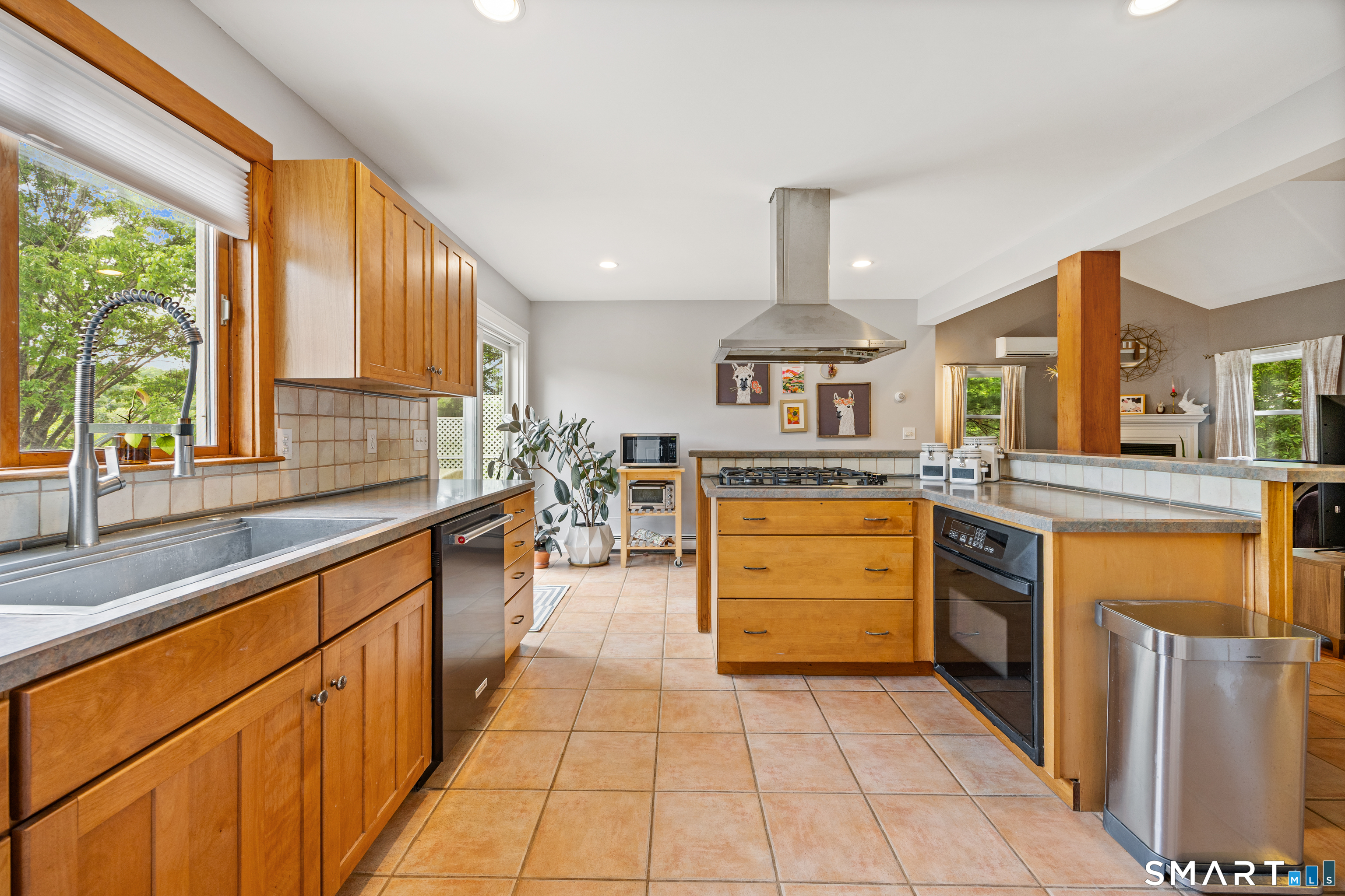 694 Millbrook Road Middletown, CT 06457 - Photo 8 of 34 a kitchen with stainless steel appliances granite countertop a stove and a sink